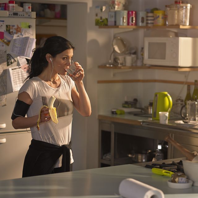 woman in the kitchen preparing for run