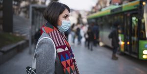 woman in town wearing protective face mask