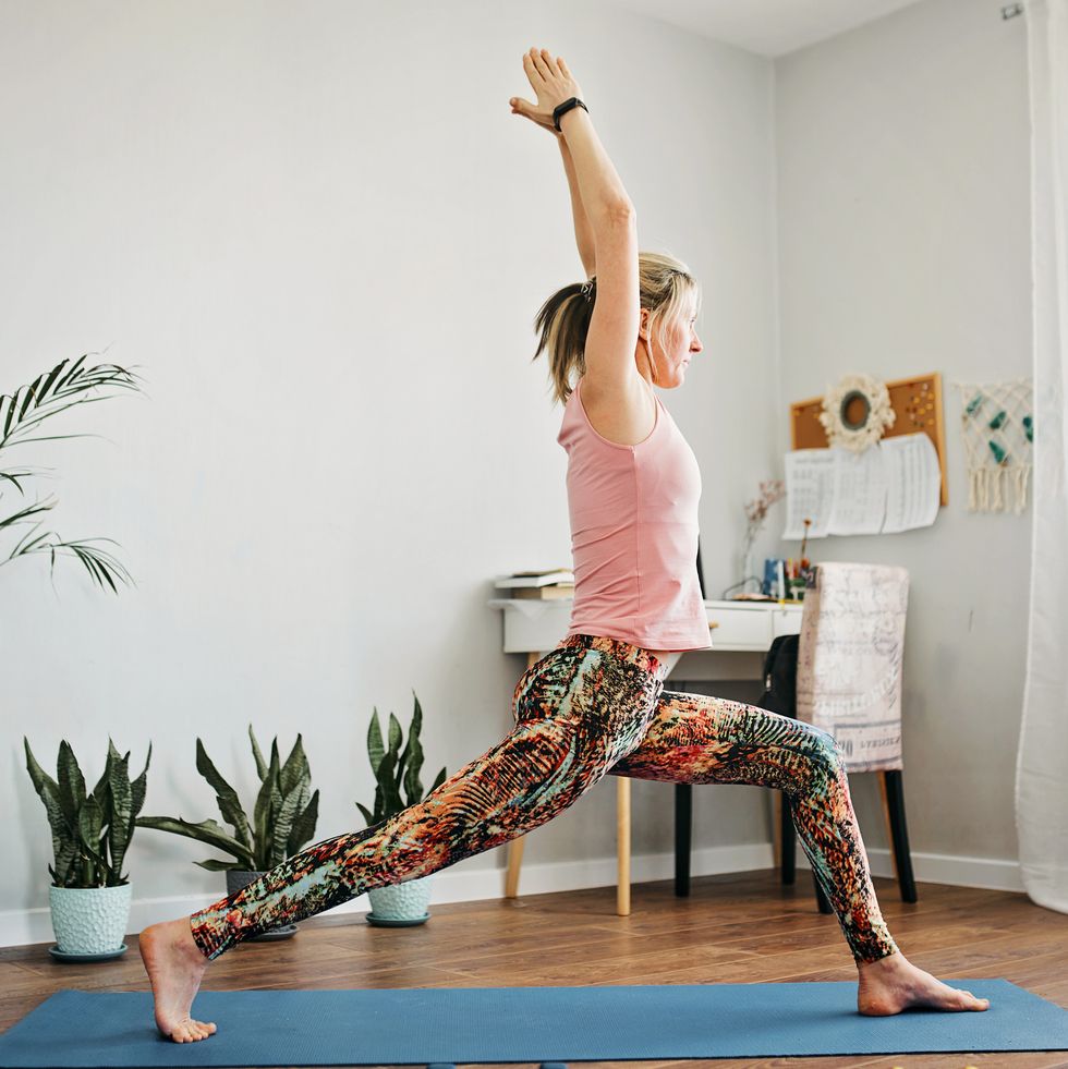 a women doing yoga in her living room