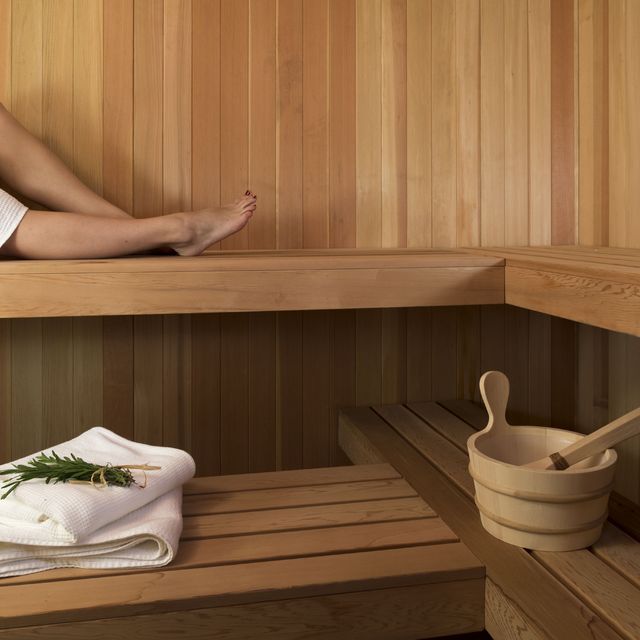 Woman is Sauna with beverage and herbs, Blair Hill Inn, Greenville, Maine