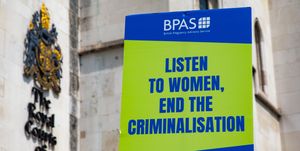 an abortion reform protest sign pictured outside of the royal courts of justice that reads listen to women, end the criminalisation