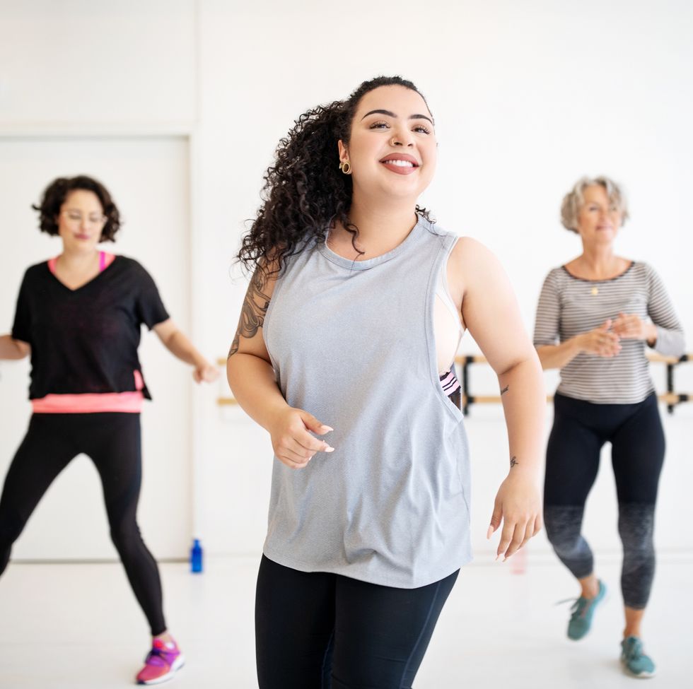 staycation ideas - Woman learning dance moves in a class