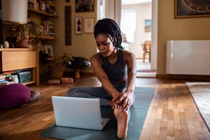 woman learning the janu sirsasana pose