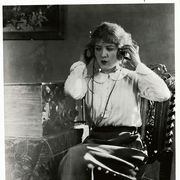 Woman Listening to a Radio