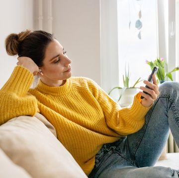 woman listening to relaxation audio from mobile app