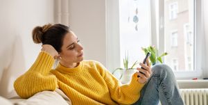 woman listening to relaxation audio from mobile app