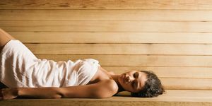 woman lying in sauna