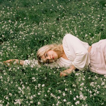 woman lying on grass in summer