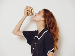 a woman made a cake she grabbed it with her hands and eats it