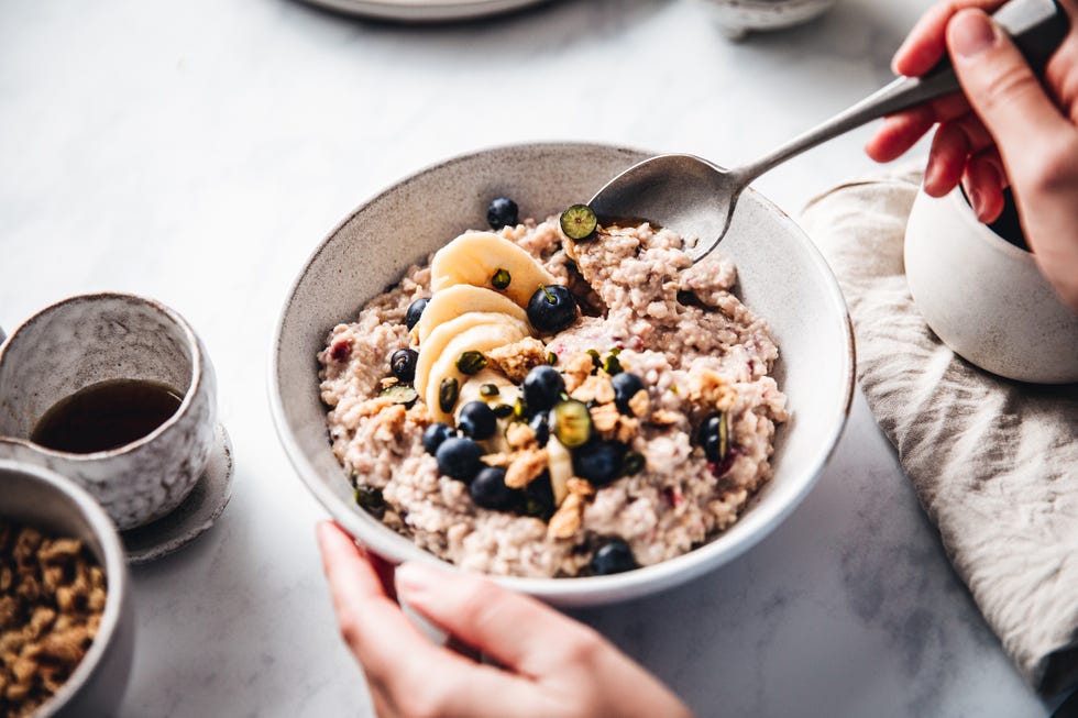 woman making healthy breakfast in kitchen