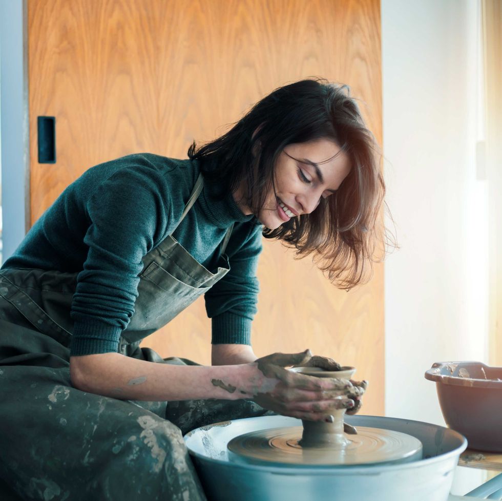 woman making pottery