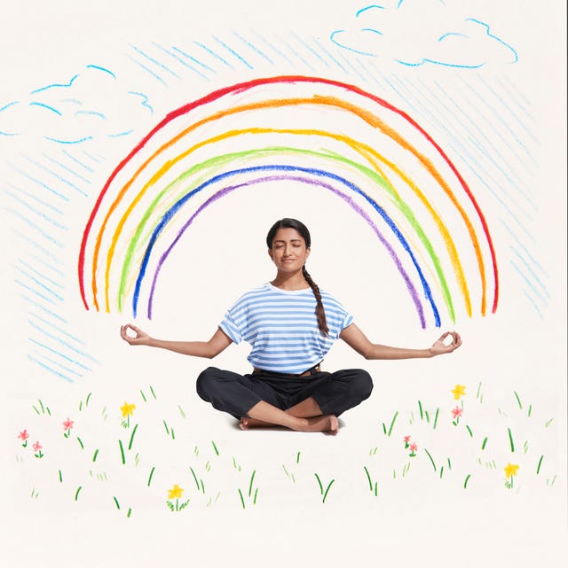 woman meditating with rainbow