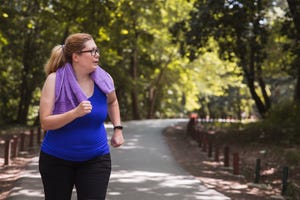 woman observing surroundings when jogging