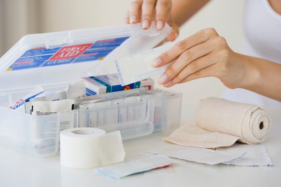 woman packing first aid kit