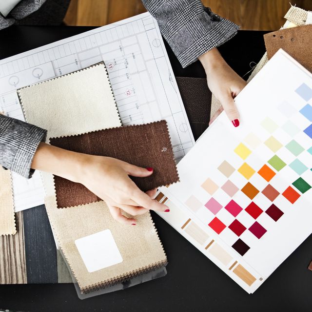 woman picking out swatches from desk