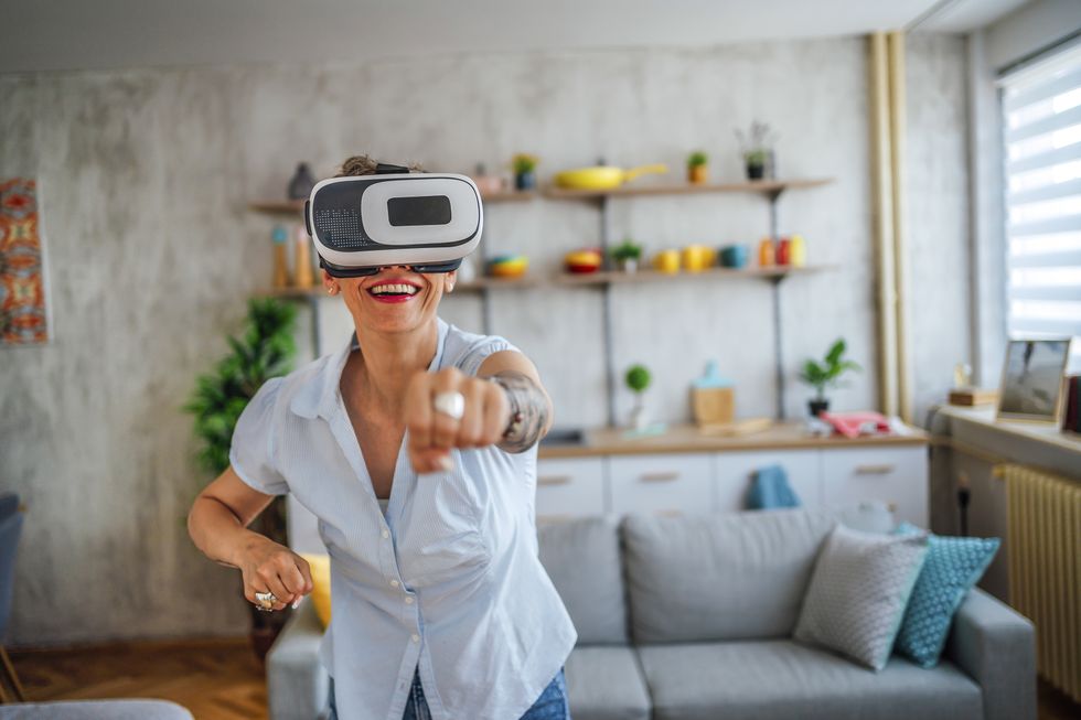 woman playing a virtual reality game at home
