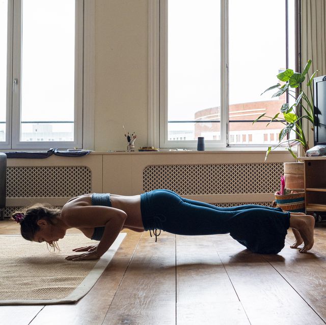 woman practicing in plank pose  at home