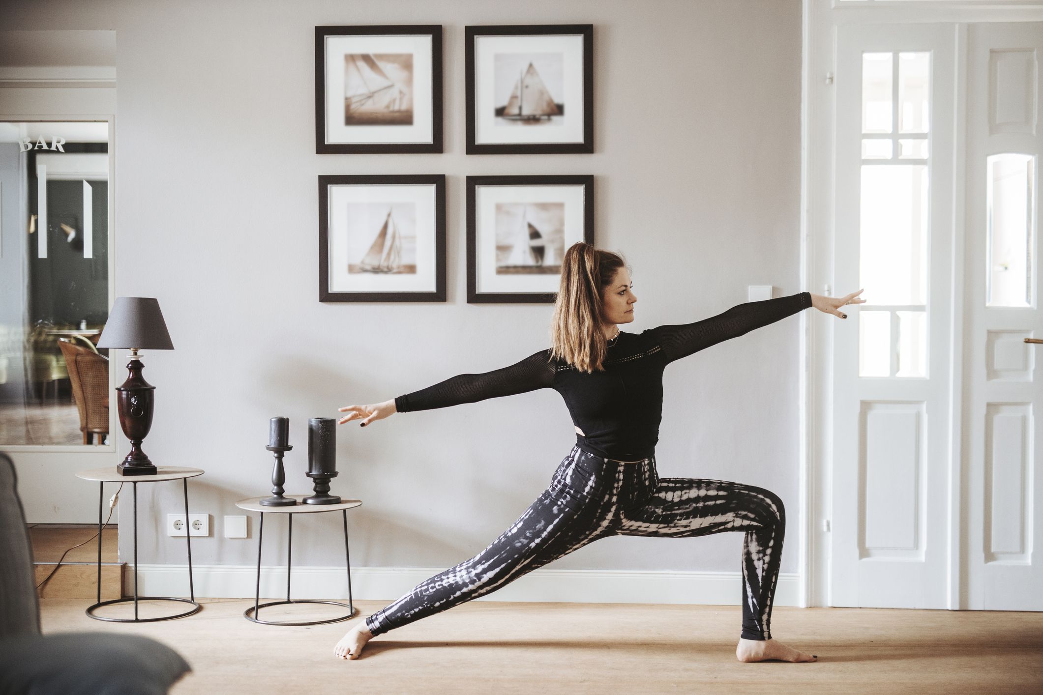 woman practising yoga at home warrior pose royalty free image