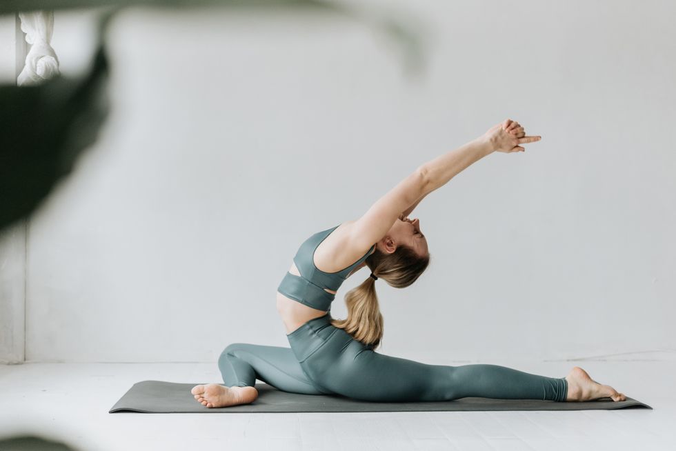 woman practising yoga in studio