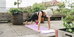 woman practising yoga on a roof terrace