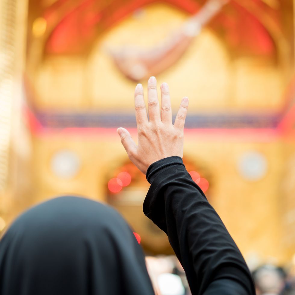 woman praying inside a mosque
