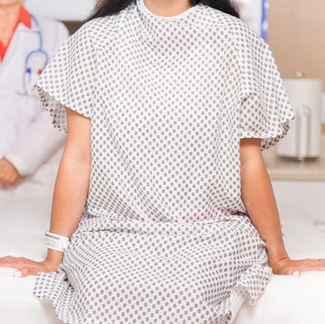 Woman prepares for breast exam, mammogram at doctor's office or hospital. woman prepares for breast exam, mammogram at doctor's office or hospital
