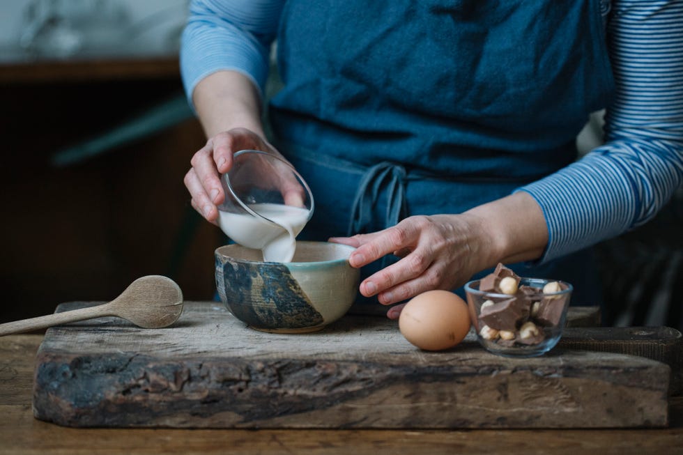 Woman preparing dessert, partial view
