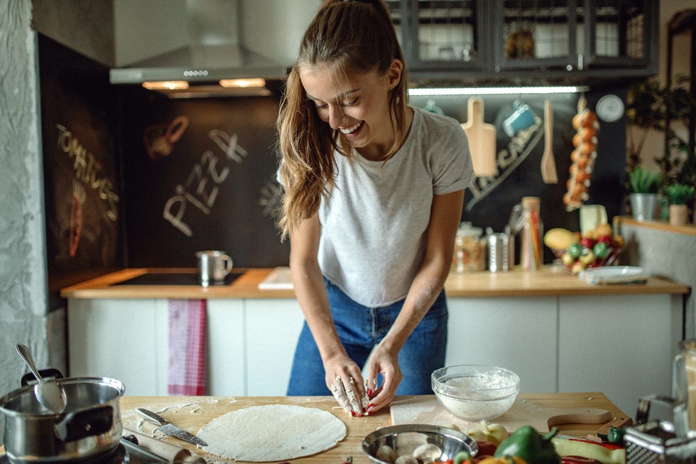 woman preparing dought for pizza
