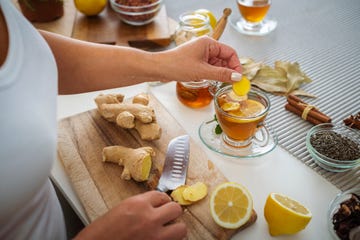 woman preparing ginger and lemon hot tea