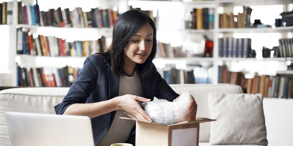 Woman preparing parcel for shipment