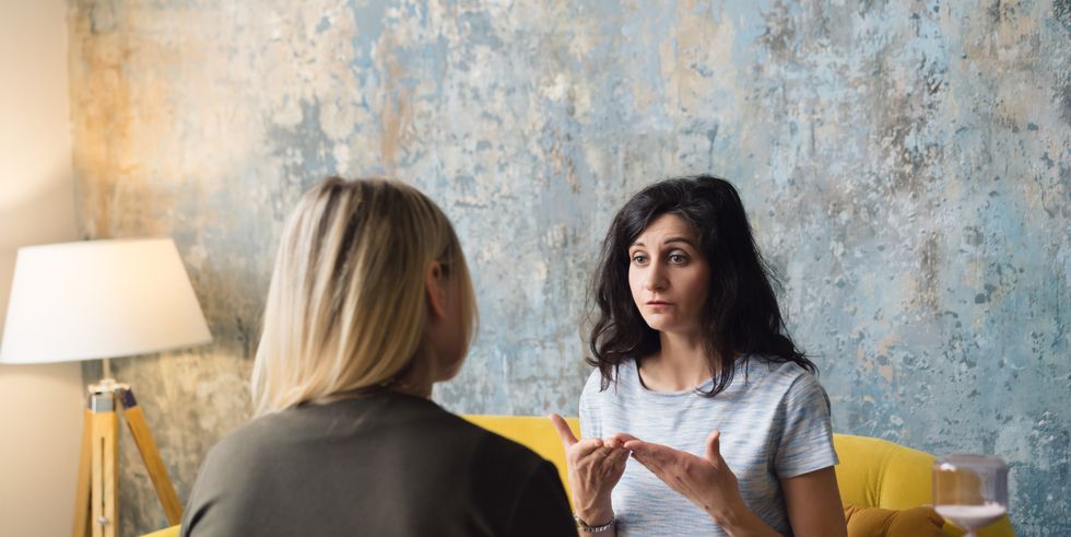 woman psychologist talking to patient