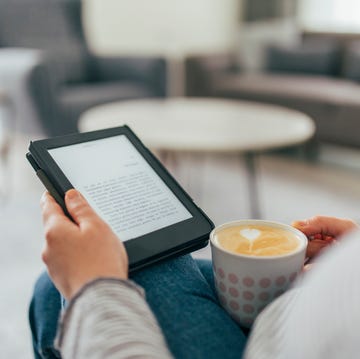 Woman Reading E-Book at Home woman reading e book at home