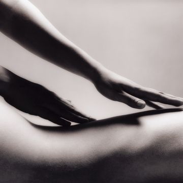 woman receiving back massage, close up bw