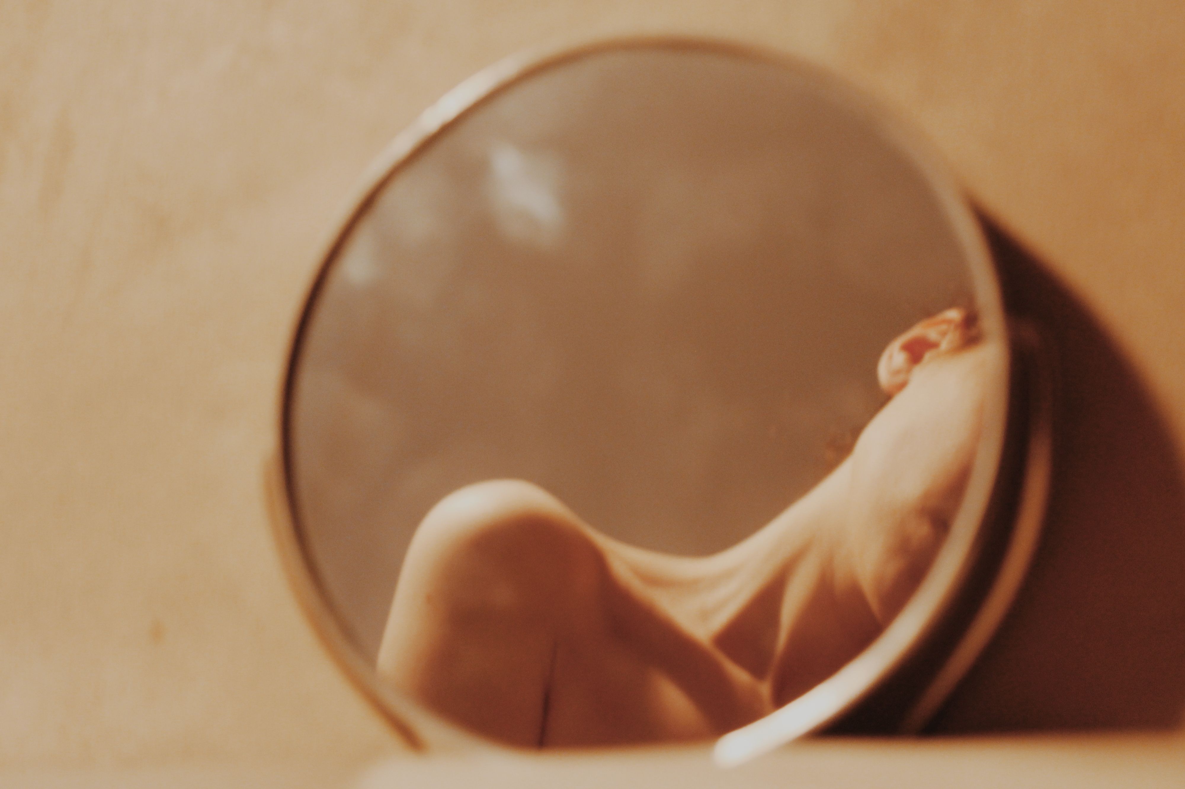 woman reflecting on mirror