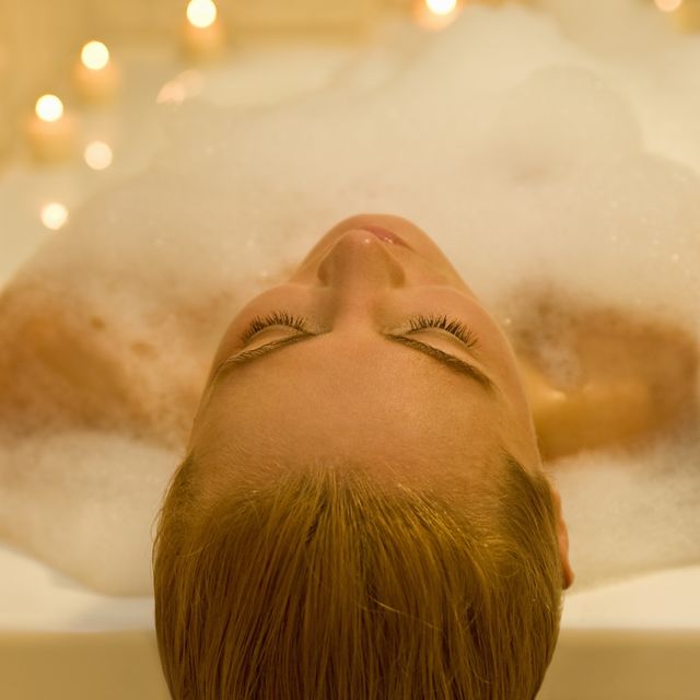 woman relaxing peacefully in a spa resort