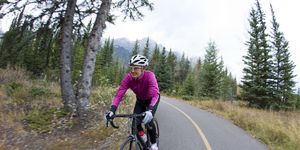 a woman rides her road bike along the trans canada trail bikepath, cycling efficiency tips