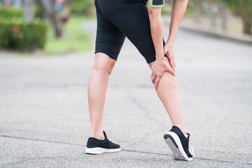 woman runner sports injured leg  pain relief concept