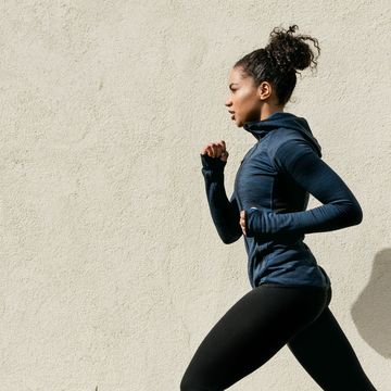 Woman Running Against Wall