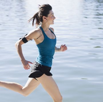 woman aj4 running along lake