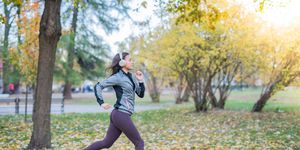 woman running in autumn park