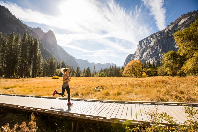 a woman running in nature