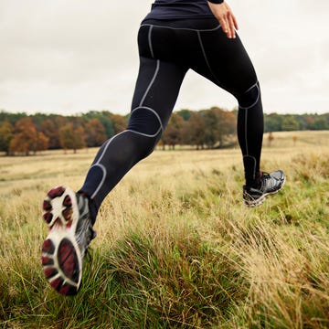 woman running in nature with autumn colors