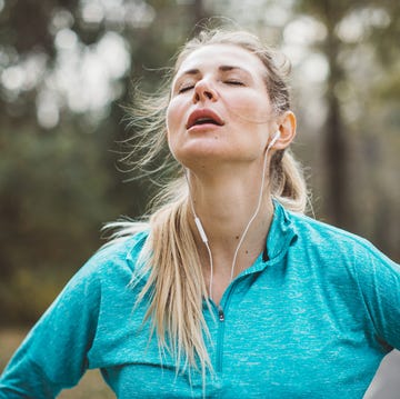 Woman running in park melatonin side effects woman running in park