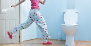 woman running to toilet in night clothes