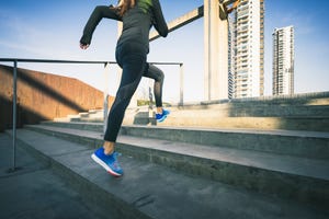 woman running up stairs,low section