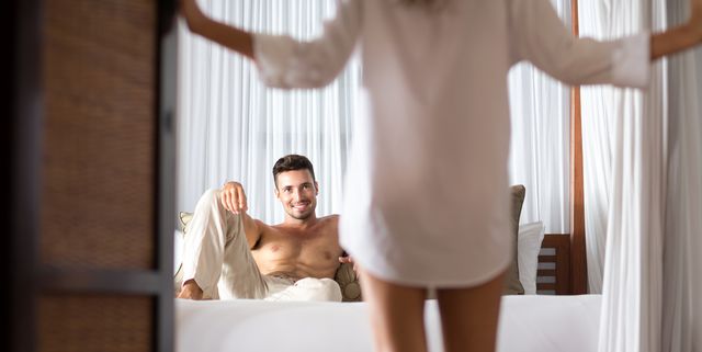 woman seduces her boyfriend in the bedroom