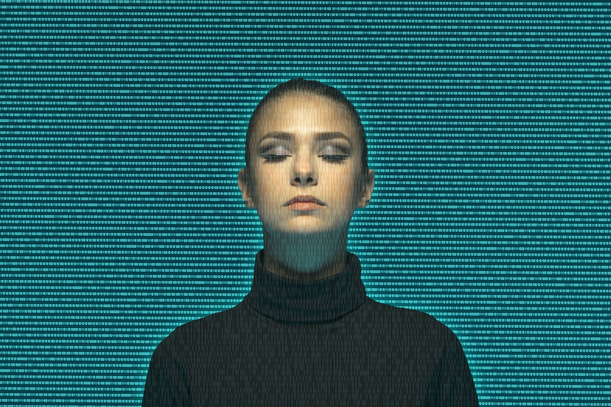 woman seen through a mass of binary numbers