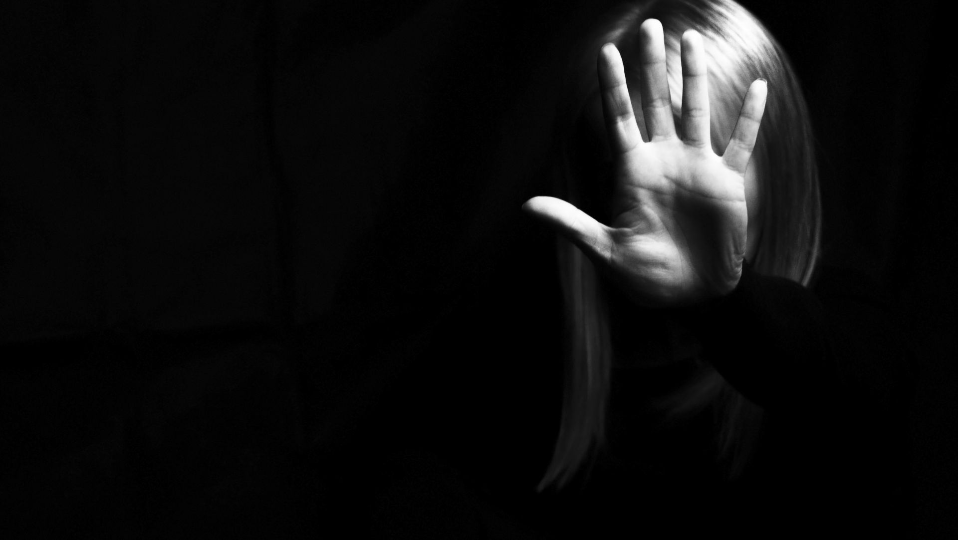 a woman showing gesture stop violence against women concept