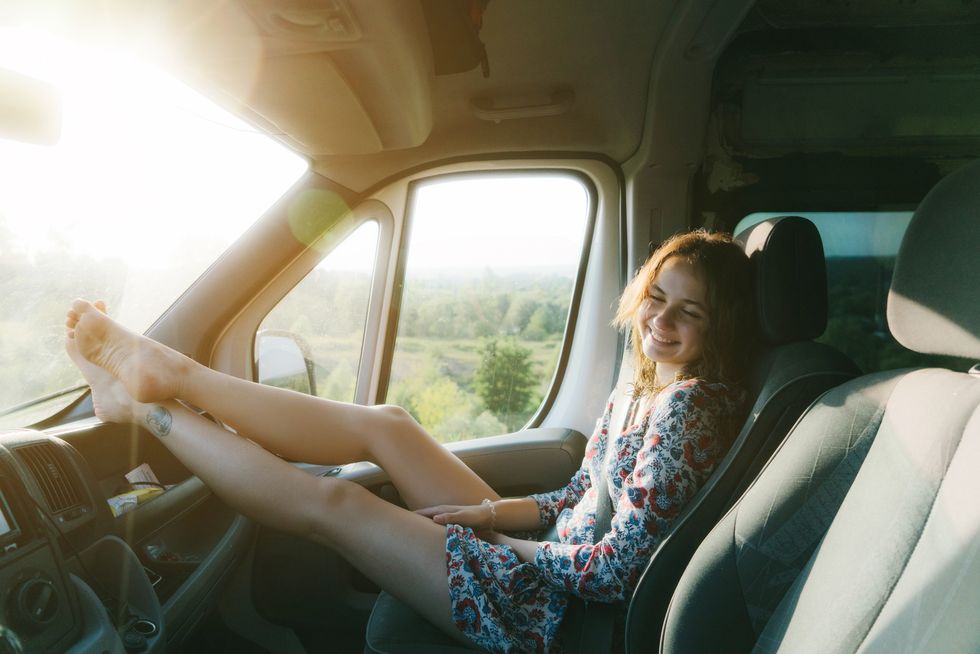 woman sitting in the van as passenger
