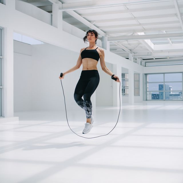woman skipping rope in fitness studio